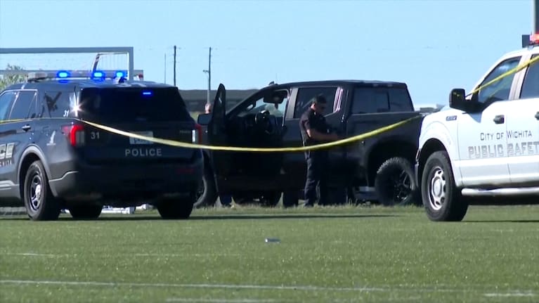 Police vehicles blocked the football field as they investigated the scene