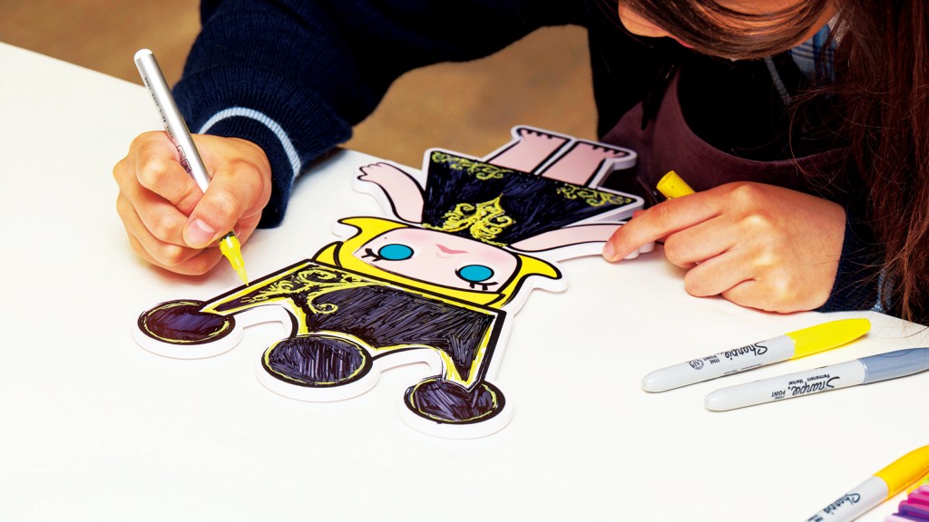 Deep in concentration, a student added a personal touch to her MOLLY artwork. Deep in concentration, a student added a personal touch to her MOLLY artwork.