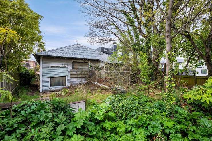 A quake-damaged bungalow on Salisbury Street, in central Christchurch, is being sold for the first time in 40 years. Photo / Supplied
