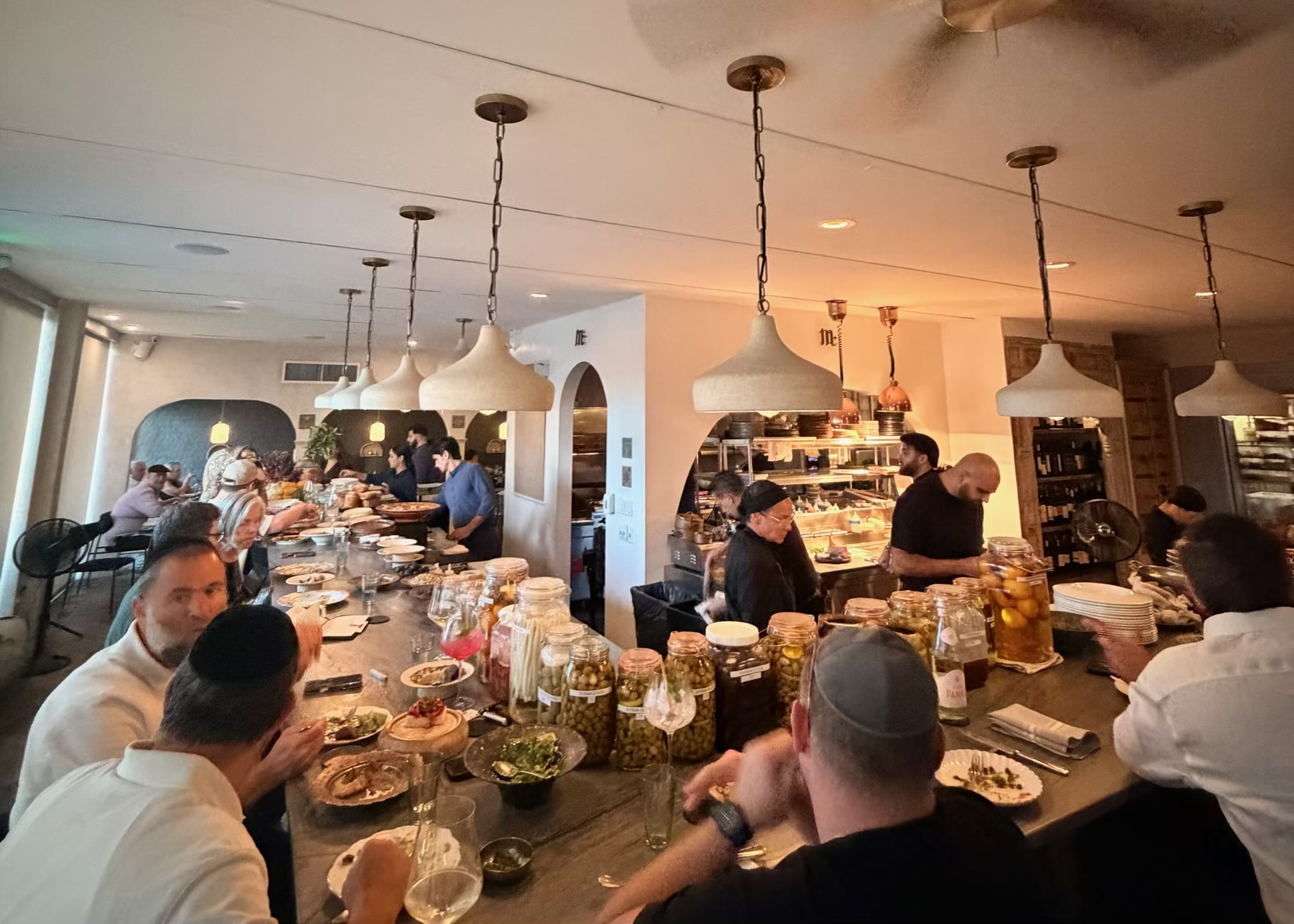 Guests dining at the chef's counter at Mutra in North Miami