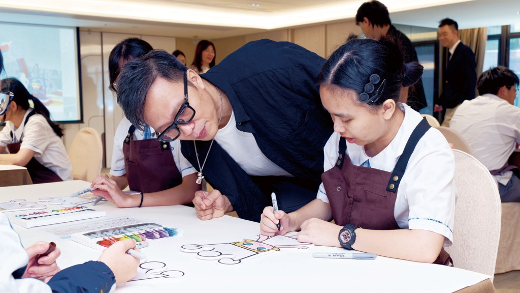 Kenny Wong worked alongside the students, offering guidance and creative tips as they brought their own MOLLY designs to life. Kenny Wong worked alongside the students, offering guidance and creative tips as they brought their own MOLLY designs to life.