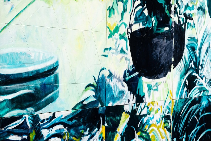 A series of blue, black and white misaligned panels depicting a balcony garden with hanging basket.