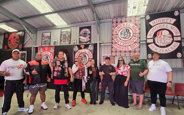 Te Pāti Māori MP Oriini Kaipara, with Green candidates Hūhana Lyndon and Michel Mulipola, Te Whatanui Skipwith (far right) Ōtāhuhu Green Party candidate, along with the Mongrel Mob's Harry Tam and other members.