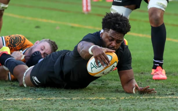 Peter Lakai of New Zealand goes over to score.