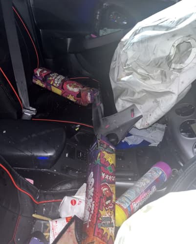 The inside of Elizabeth Bing's car after the crash, with nitrous oxide cannisters. Photo / NZ Police