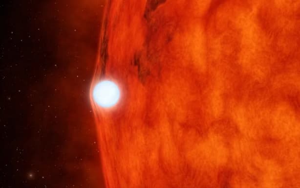 An artist's depiction of a white dwarf passing in front of a small red star. NASA/JPL-Caltech