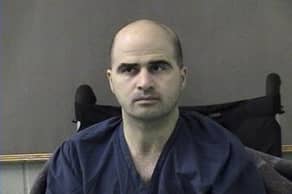(FILES)This April 9, 2010 file photo released by the Bell County Sheriffs Department, shows US Major Nidal Hasan after being moved from Brooke Army Medical Center in San Antonio to Bell County Jail in Belton, Texas. The army psychiatrist accused of killing 13 people in a shooting spree on a Texas army base on November 15, 2010 offered no evidence in a hearing set to determine whether he should stand trial. Major Nidal Malik Hasan, who was paralyzed from the chest down in the incident on November 5, 2009, sat implacably in his wheelchair wearing a camouflage uniform and light green watch cap. Asked by an Army judge if he had anything to say, he replied "no."
AFP PHOTO/BELL COUNTY SHERIFFS DEPARTMENT/HANDOUT/RESTRICTED TO EDITORIAL USE (Photo by HO / BELL COUNTY SHERIFFS DEPARTMENT / AFP)