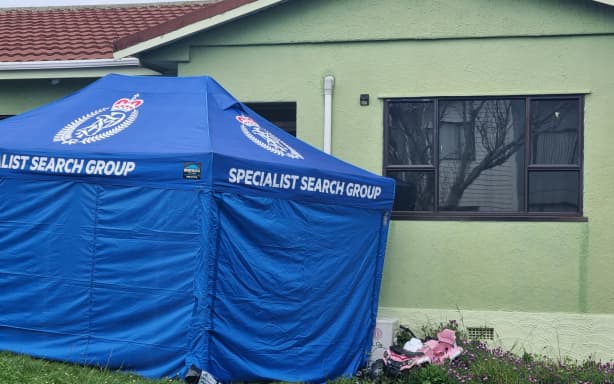 A child's bike is seen at the home of a serious incident in Auckland's Papatoetoe where three people have been found dead.