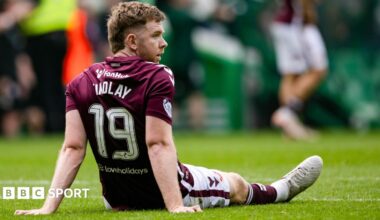 Hearts defender Stephen Kingsley pictured dejected at Celtic Park