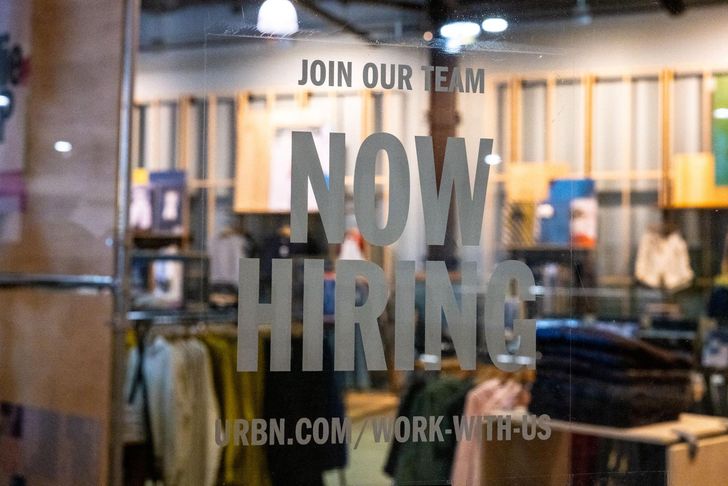 A hiring sign is posted on the exterior of Urban Outfitters at the Tysons Corner Center mall on Aug. 22, 2024 in Tysons, Virginia. Getty Images via AFP-Yonhap