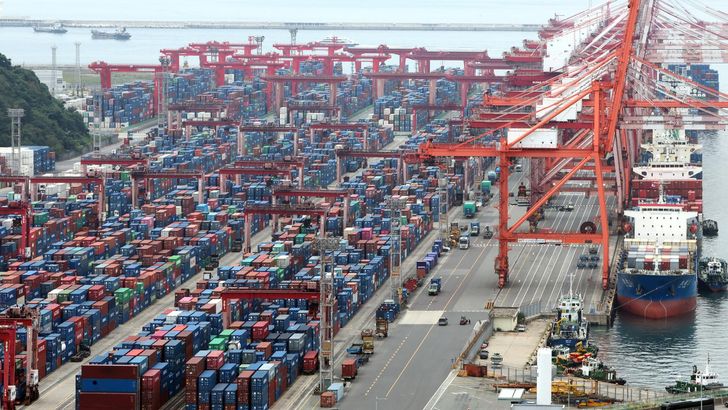 Containers are stacked at a port in the southeastern city of Busan, Oct. 1. Yonhap
