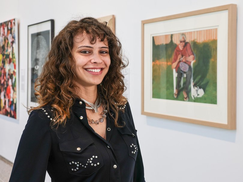 The Lester Prize 2026 finalist Lily Wilson-Nannup with her portrait My Memory Of Lolo at WA Museum Boola Bardip.