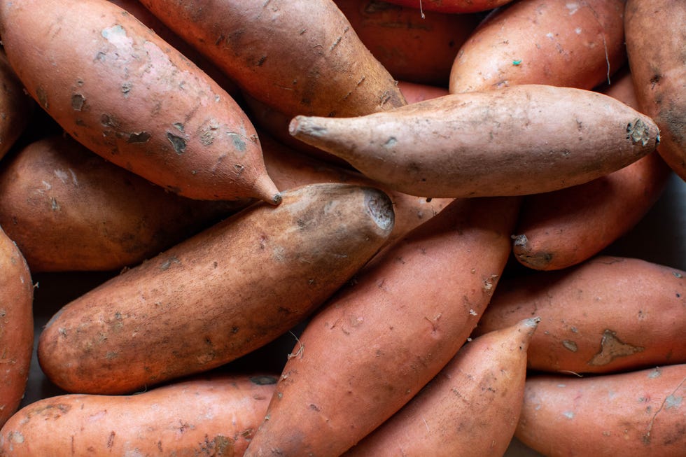 Healthy sweet potatoes filling frame, fresh raw vegetables Healthy sweet potatoes filling frame, fresh raw vegetables