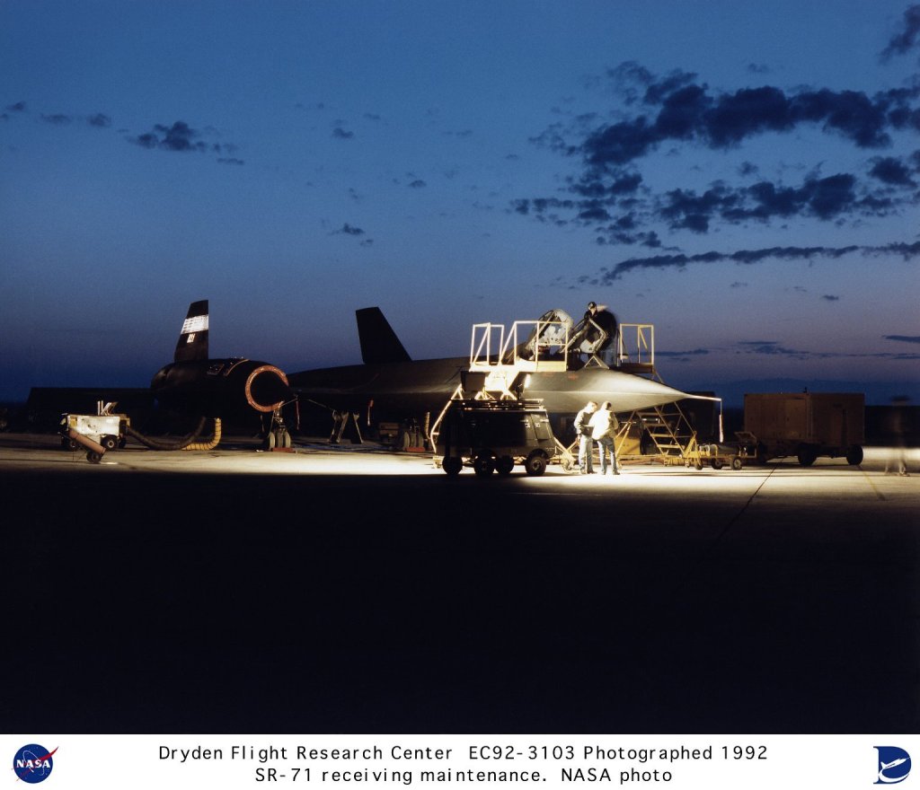 As the first traces of dawn light the eastern sky, technicians on the ramp at NASA's Ames-Dryden Flight Research Facility (later, Dryden Flight Research Center), Edwards, California, work to prepare one of NASA's SR-71 Blackbird aircraft for a research flight. Two SR-71 aircraft have been used by NASA as testbeds for high-speed and high-altitude aeronautical research. The aircraft, an SR-71A and an SR-71B pilot trainer aircraft, have been based here at NASA's Dryden Flight Research Center, Edwards, California. They were transferred to NASA after the U.S. Air Force program was cancelled. As research platforms, the aircraft can cruise at Mach 3 for more than one hour. For thermal experiments, this can produce heat soak temperatures of over 600 degrees Fahrenheit (F). This operating environment makes these aircraft excellent platforms to carry out research and experiments in a variety of areas -- aerodynamics, propulsion, structures, thermal protection materials, high-speed and high-temperature instrumentation, atmospheric studies, and sonic boom characterization. The SR-71 was used in a program to study ways of reducing sonic booms or over pressures that are heard on the ground, much like sharp thunderclaps, when an aircraft exceeds the speed of sound. Data from this Sonic Boom Mitigation Study could eventually lead to aircraft designs that would reduce the "peak" overpressures of sonic booms and minimize the startling affect they produce on the ground. One of the first major experiments to be flown in the NASA SR-71 program was a laser air data collection system. It used laser light instead of air pressure to produce airspeed and attitude reference data, such as angle of attack and sideslip, which are normally obtained with small tubes and vanes extending into the airstream. One of Dryden's SR-71s was used for the Linear Aerospike Rocket Engine, or LASRE Experiment. Another earlier project consisted of a series of flights using the SR-71 as a science camera platform for NASA's Jet Propulsion Laboratory in Pasadena, California. An upward-looking ultraviolet video camera placed in the SR-71's nosebay studied a variety of celestial objects in wavelengths that are blocked to ground-based astronomers. Earlier in its history, Dryden had a decade of past experience at sustained speeds above Mach 3. Two YF-12A aircraft and an SR-71 designated as a YF-12C were flown at the center between December 1969 and November 1979 in a joint NASA/USAF program to learn more about the capabilities and limitations of high-speed, high-altitude flight. The YF-12As were prototypes of a planned interceptor aircraft based on a design that later evolved into the SR-71 reconnaissance aircraft. Dave Lux was the NASA SR-71 project manger for much of the decade of the 1990s, followed by Steve Schmidt. Developed for the USAF as reconnaissance aircraft more than 30 years ago, SR-71s are still the world's fastest and highest-flying production aircraft. The aircraft can fly at speeds of more than 2,200 miles per hour (Mach 3+, or more than three times the speed of sound) and at altitudes of over 85,000 feet. The Lockheed Skunk Works (now Lockheed Martin) built the original SR-71 aircraft. Each aircraft is 107.4 feet long, has a wingspan of 55.6 feet, and is 18.5 feet high (from the ground to the top of the rudders, when parked). Gross takeoff weight is about 140,000 pounds, including a possible fuel weight of 80,280 pounds. The airframes are built almost entirely of titanium and titanium alloys to withstand heat generated by sustained Mach 3 flight. Aerodynamic control surfaces consist of all-moving vertical tail surfaces, ailerons on the outer wings, and elevators on the trailing edges between the engine exhaust nozzles. The two SR-71s at Dryden have been assigned the following NASA tail numbers: NASA 844 (A model), military serial 61-7980 and NASA 831 (B model), military serial 61-7956. From 1990 through 1994, Dryden also had another "A" model, NASA 832, military serial 61-7971. This aircraft was returned to the USAF inventory and was the first aircraft reactivated for USAF reconnaissance purposes in 1995. It has since returned to Dryden along with SR-71A 61-7967. NASA Identifier: NIX-EC92-3103-8