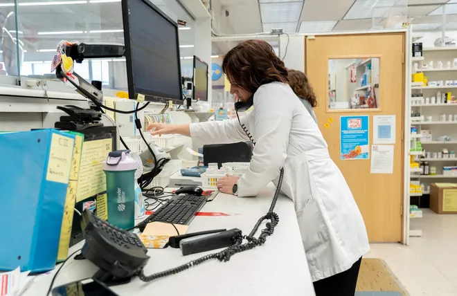 Pharmacist Amy Antibus works on a prescription order at Discount Drug Mart in North Canton on Mar. 6, 2026.