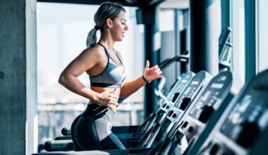 Woman running on a treadmill during treadmill workout, left arm forward right arm back