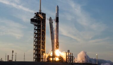 a big white rocket launches into a cloudy sky