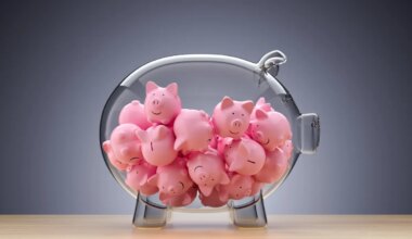 glass piggy bank full of little pink piggies