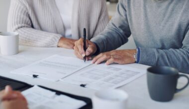 Cropped shot of a senior couple meeting with a consultant to discuss paperwork at home