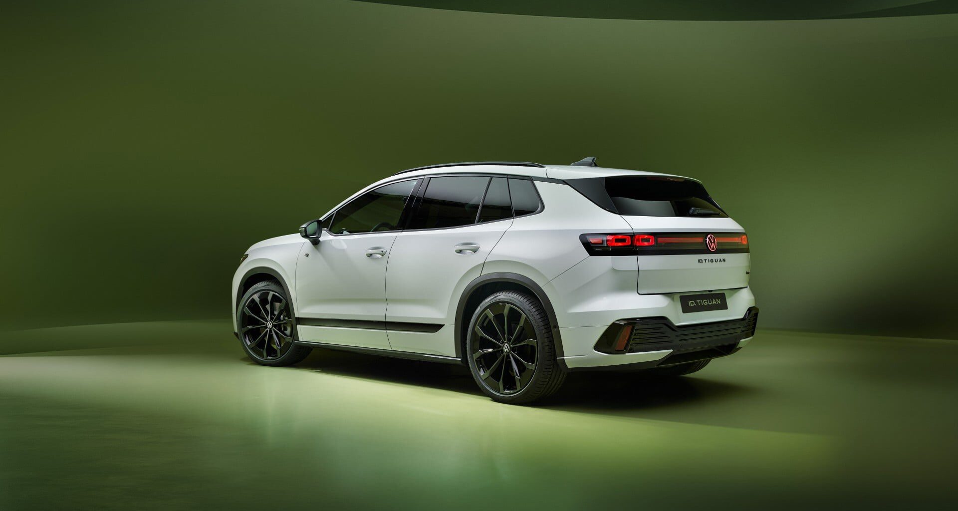 white VW SUV on a green background