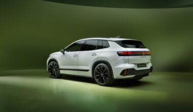 white VW SUV on a green background