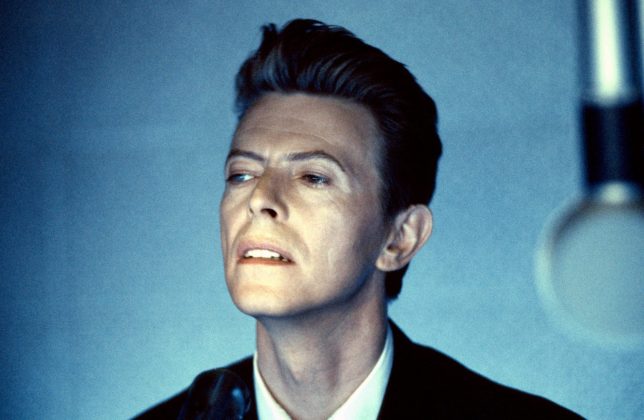 English singer David Bowie (1947 - 2016) performs on the set of his music video 