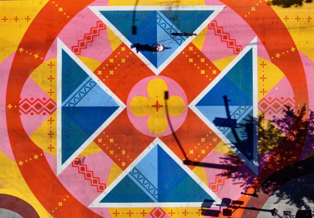 "Napa Tapestry," designed by Washington-based artist Danielle Davis, adorns the pedestrian scramble at Main and Second streets in Napa on Tuesday, October 6, 2026. (Christopher Chung/The Press Democrat)
