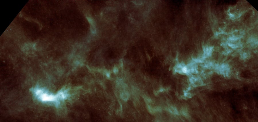 A view of the Taurus Molecular Cloud from the Herschel Space Observatory. The bright region at the lower left is the pre-stellar core Lynds 1544. Astronomers looked at it using radio astronomy techniques to understand what's happening in a prestellar core. [ESA/Herschel/SPIRE]