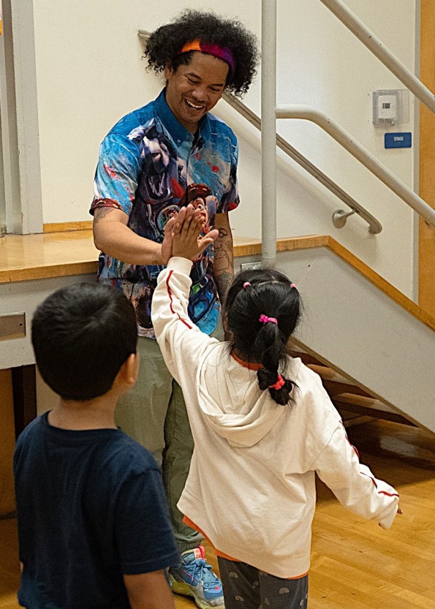 Mychal Threets high-fives students at an assembly at Cleo Gordon Elementary School in Fairfield during a visit in May 2026. (COURTESY)