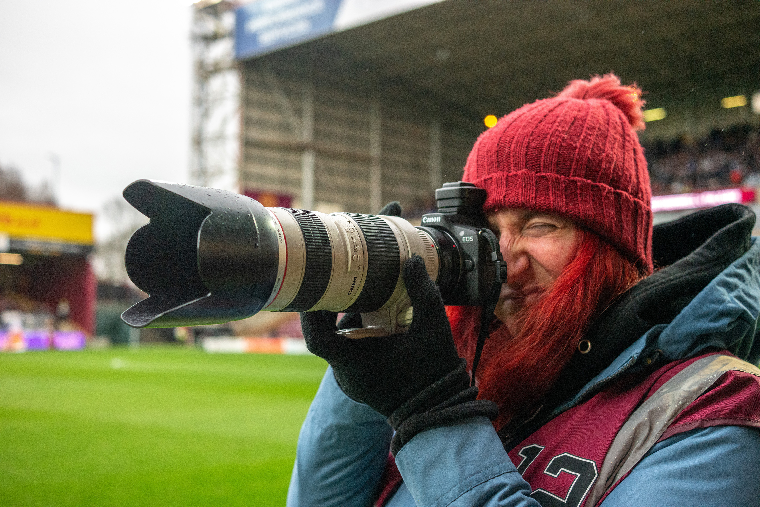 Photography student Chantelle Cook photographing soccer action during the Scottish Premiership clash between Motherwell and Falkirk, April 4, 2026.