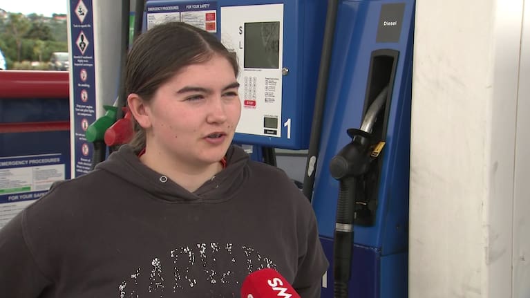 A young voter at the fuel pump.