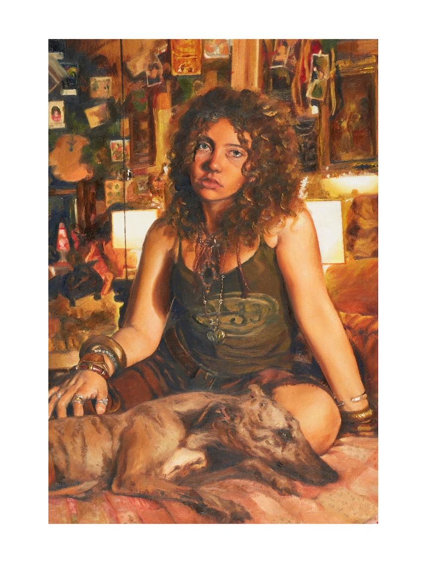 Oil painting of a young woman sitting on a bed in a lamplit room, a greyhound curled in front of her