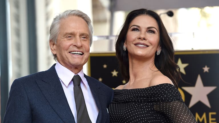 Actor Michael Douglas, left, and his wife Catherine Zeta-Jones appear at a ceremony honoring him with a star on the Hollywood Walk of Fame in Los Angeles in 2018