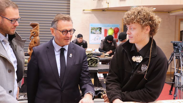 Arras Mayor Frédéric Leturque with New Zealand Māori Arts and Crafts Institute student Tiaan Greig.