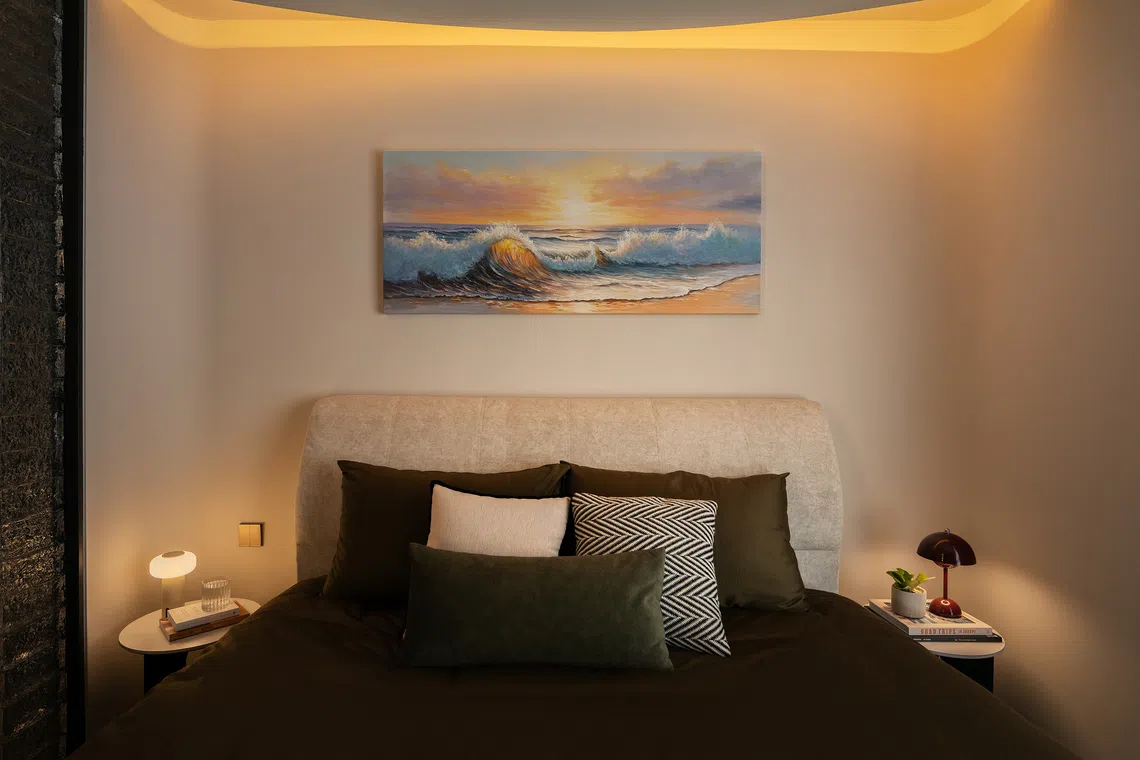 A curved ceiling detail and warm cove lighting transform the master bedroom into a cocoon-like zone.