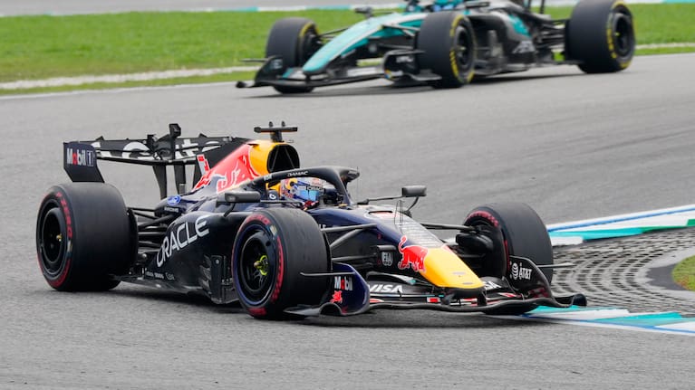 Red Bull driver Max Verstappen of the Netherlands steers his car ahead of Mercedes drivers George Russell of Britain during the Bahrain Grand Prix in Sepang, Malaysia,