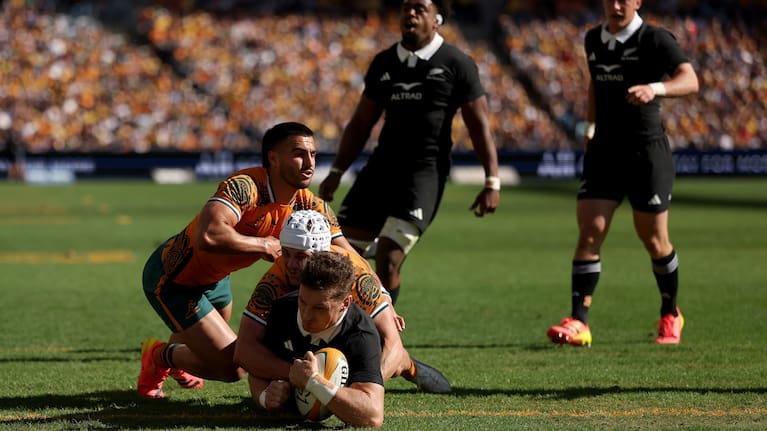 Beauden Barrett of the All Blacks scores a try against the Wallabies in Sydney.