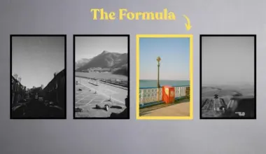 Four framed prints; the third, a seaside pier with a red phone box, is in color while the others are black and white.
