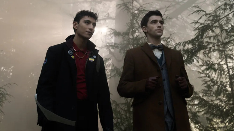 Charles Rowland (Jayden Revri) and Edwin Payne (George Rexstrew) standing in a forest on 