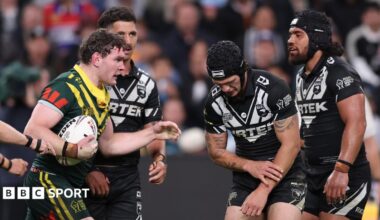 New Zealand's Kalyn Ponga feels his injured left arm during the World Cup game against Australia