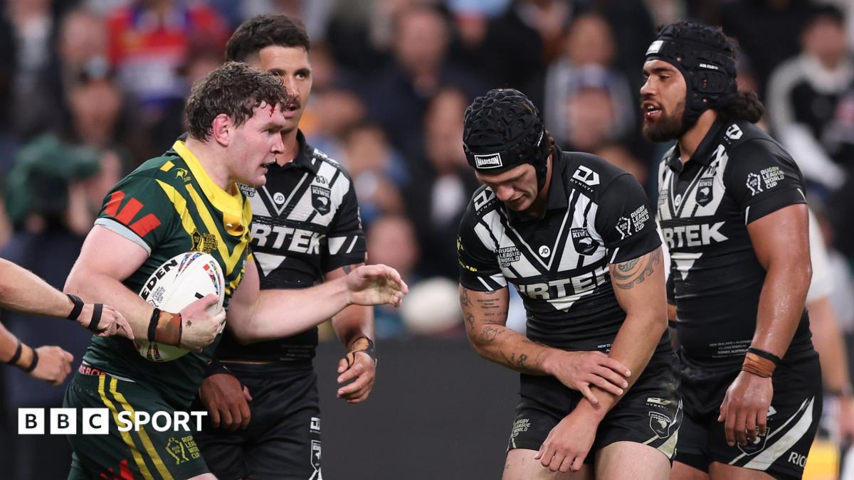 New Zealand's Kalyn Ponga feels his injured left arm during the World Cup game against Australia