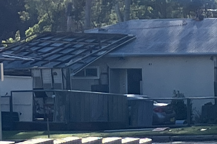 image of house with damage to roof.