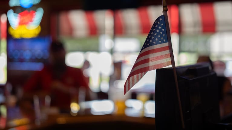 An American flag is posted on the register at Fricker's restaurant and bar in Springfield, Ohio