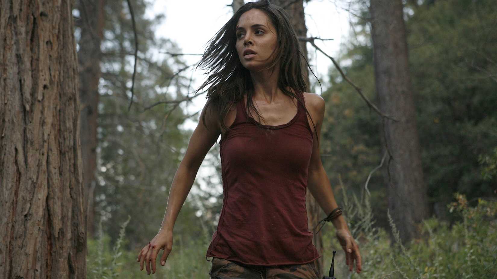Eliza Dushku as Echo running through the woods on Dollhouse.