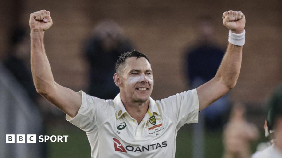 Scott Boland celebrates wicket with his arms held out