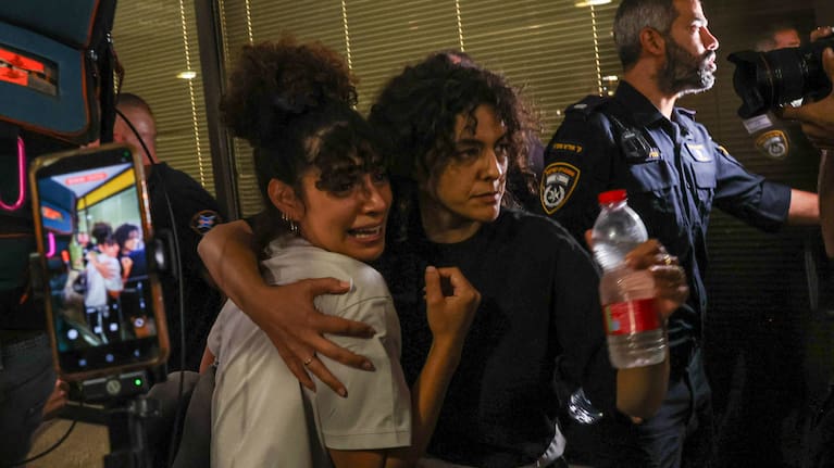 Passengers arrive in Tel Aviv after the diverted flight and attack.