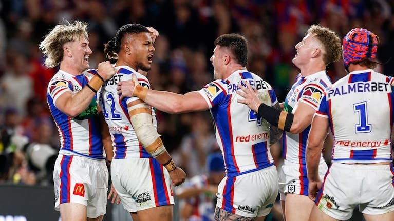 Francis Manuleleua of the Knights celebrates scoring a try with team mates during the 2026 NRL grand final match between the Sydney Roosters and the Newcastle Knights at Accor Stadium in Sydney, Sunday, October 4, 2026.