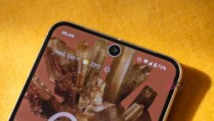 top half of google pixel 8 on yellow background
