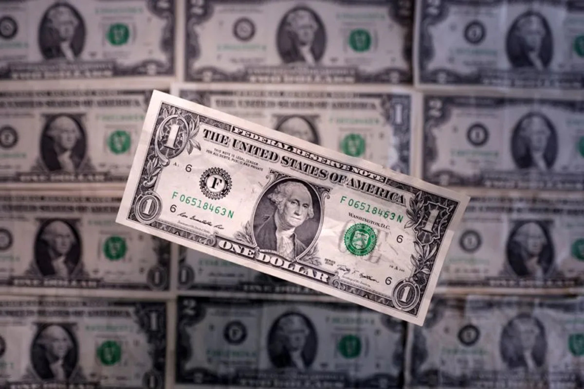 Dollar recedes from 18-month high as bond rally tempers impact of hot inflation data