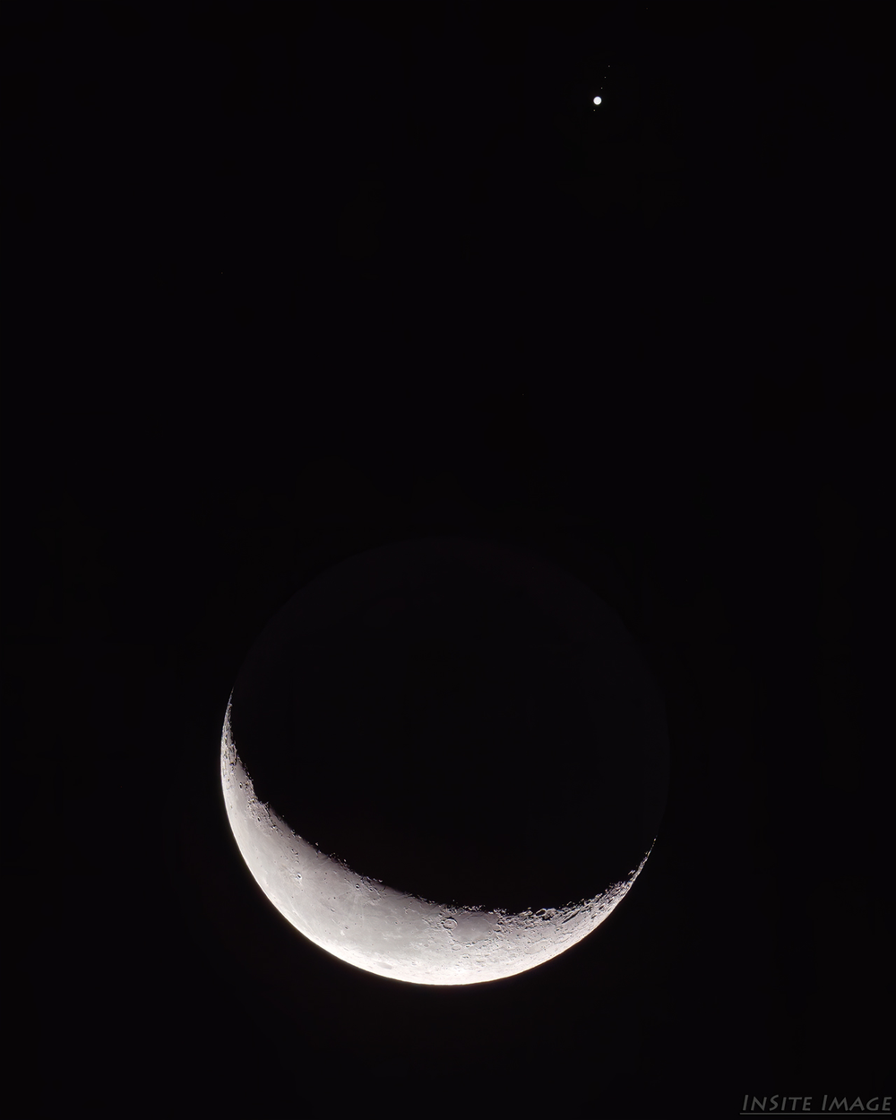 The moon approaching Jupiter early Tuesday morning.